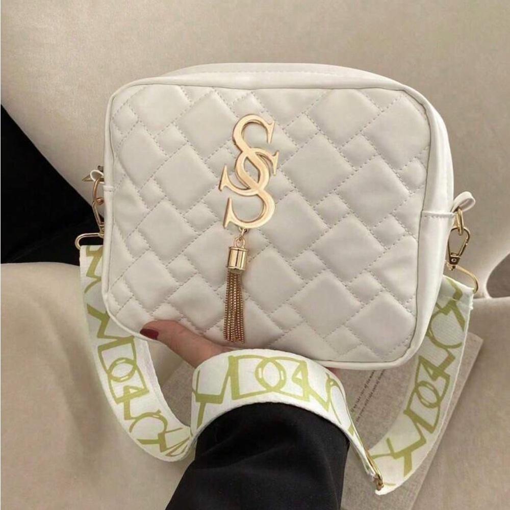Chic Quilted White Shoulder Bag with Gold Accents in Great Condition